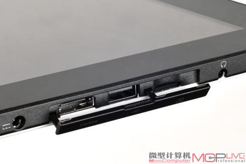 磁性保护罩覆盖下的扩展接口。对于家庭，标准HDMI接口更便于共用预埋的HDMI线输出视频；USB接口测试显示可支持鼠标、U盘等的接入，未来随着固件升级，支持的外设应该更多。